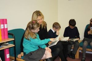 Reading with children at Crosshall School 